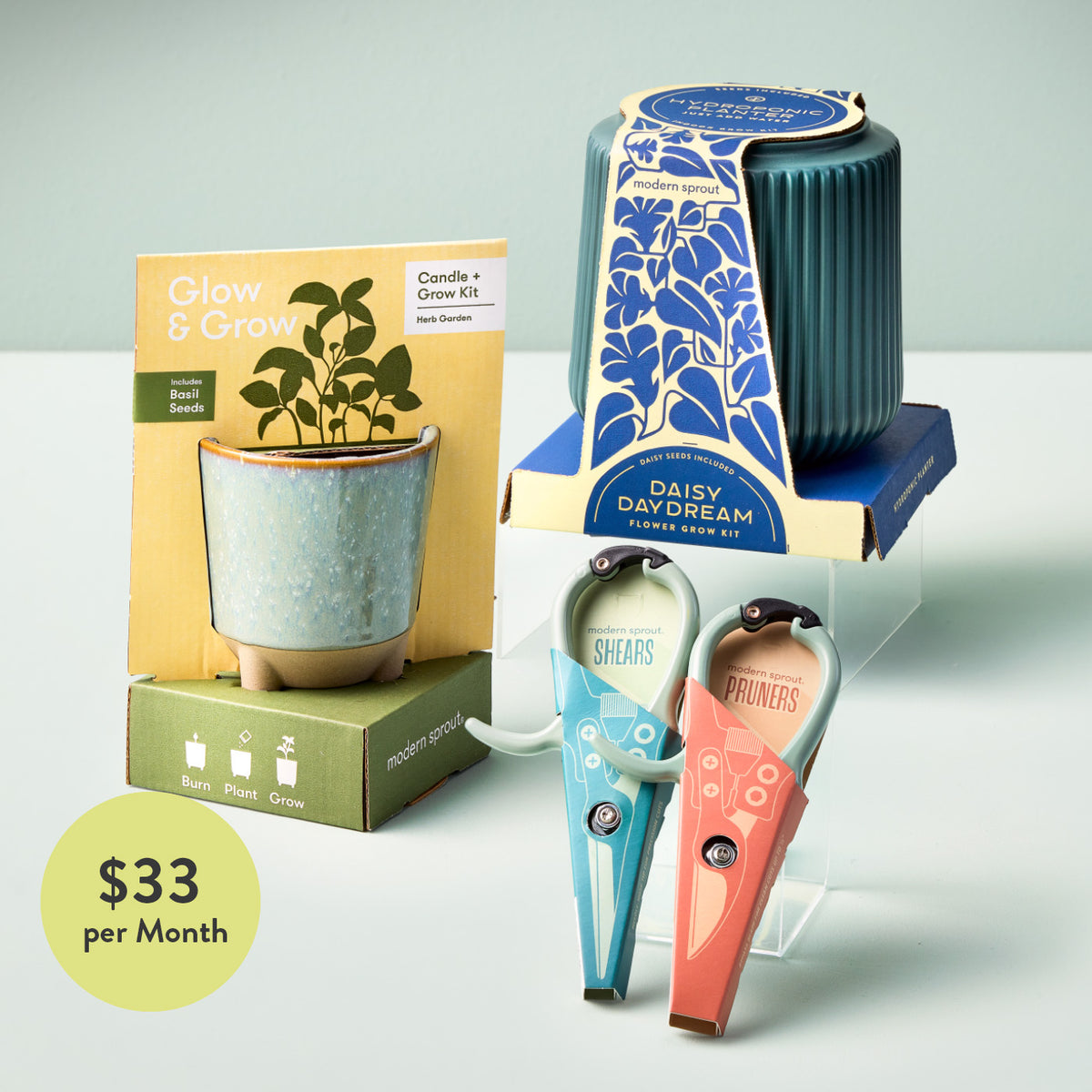Hydroponic indoor garden kit with plant accessories, seed scissors, and a grow box, priced at $33/month.