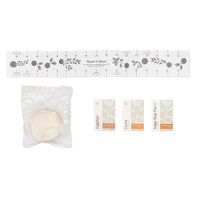 Seed ball kit featuring a planting guide, a seed ball, and seed packets for eggplant, carrot, and sugar snap pea.
