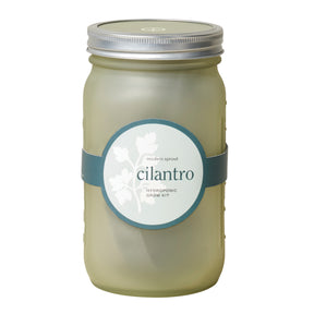 Green glass garden jar featuring a cilantro hydroponic grow kit label, designed for indoor gardening.