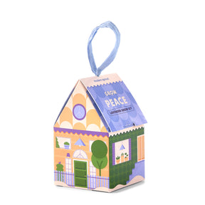 Colorful lavender grow kit shaped like a house, featuring a decorative design and a hanging ribbon for easy display.