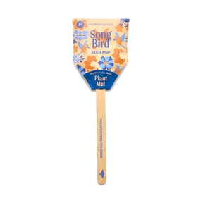 Seed Pops Pollinator features a colorful packaging design with wildflower illustrations and a wooden stick for planting.