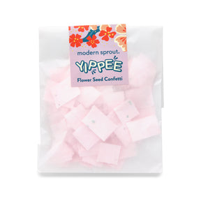 Seed paper confetti refill pack featuring pink flower-shaped confetti pieces, packaged in a clear bag with a colorful label.