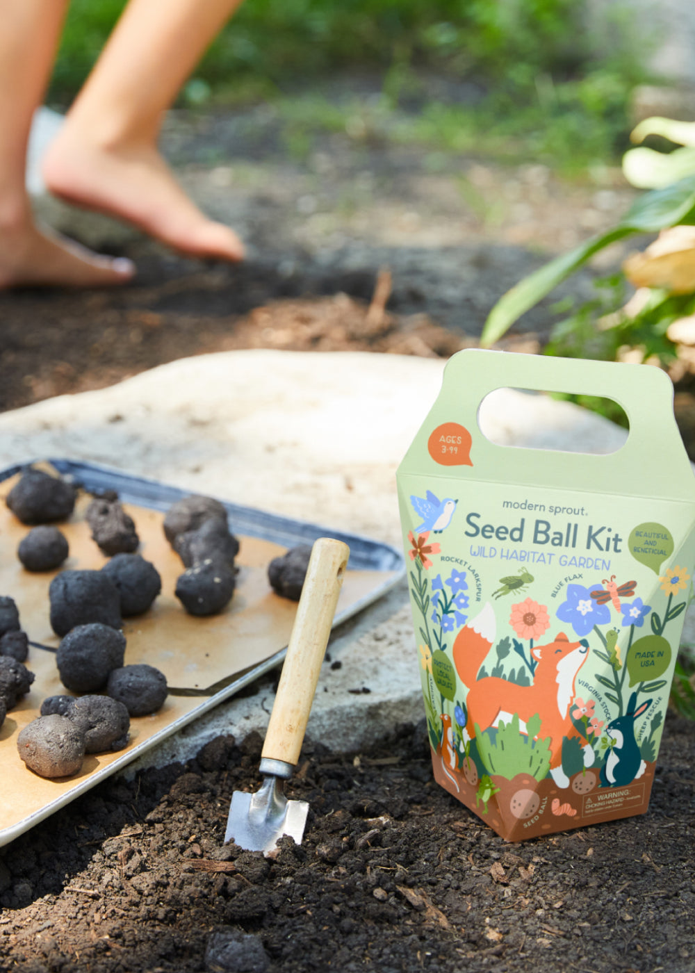 Colorful seed ball kit with flowers, animals, and plants, designed for indoor hydroponic herb and plant gardening.