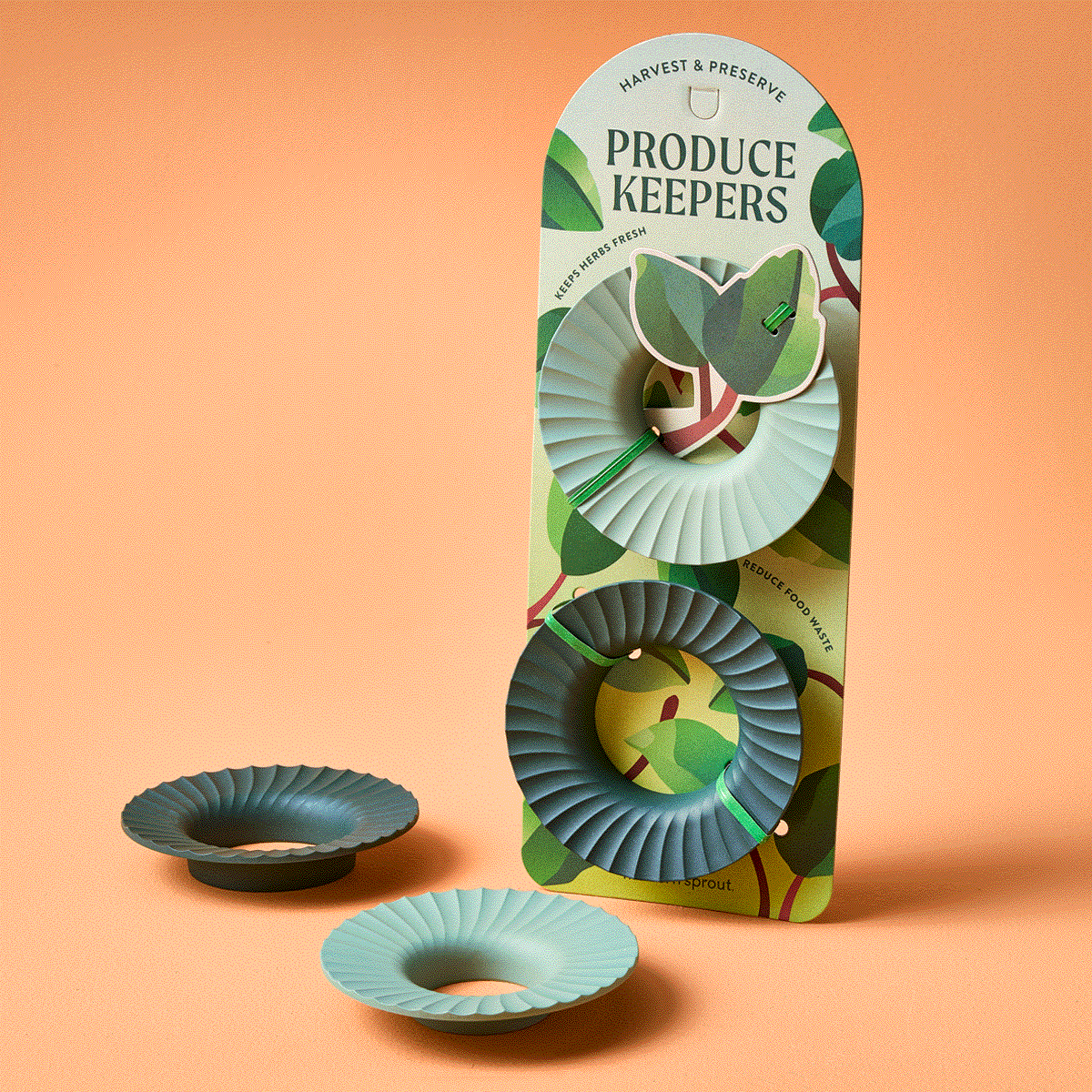 Three green produce keepers on a card featuring leaf illustrations, designed for preserving herbs and vegetables indoors.