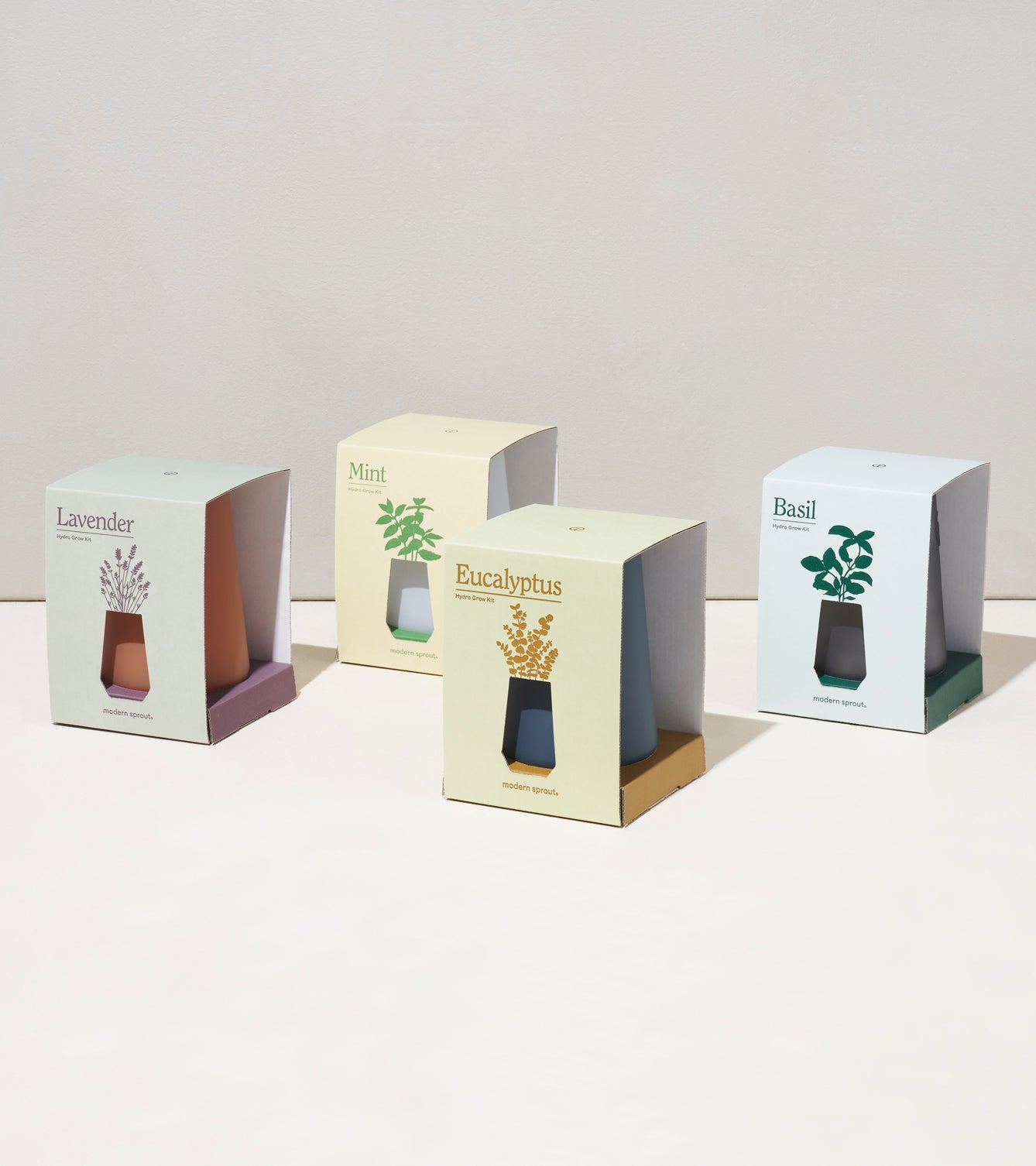 Four Tapered Tumbler Grow Kits in pastel packaging, featuring Lavender, Mint, Eucalyptus, and Basil designs.