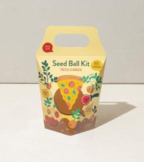 Colorful Seed Ball Kit packaging featuring a pizza garden theme with illustrations of vegetables and herbs.