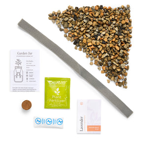 Passive Hydroponic Replant Kit featuring a garden jar, plant fertilizer, lavender seeds, growing medium, and drainage materials.